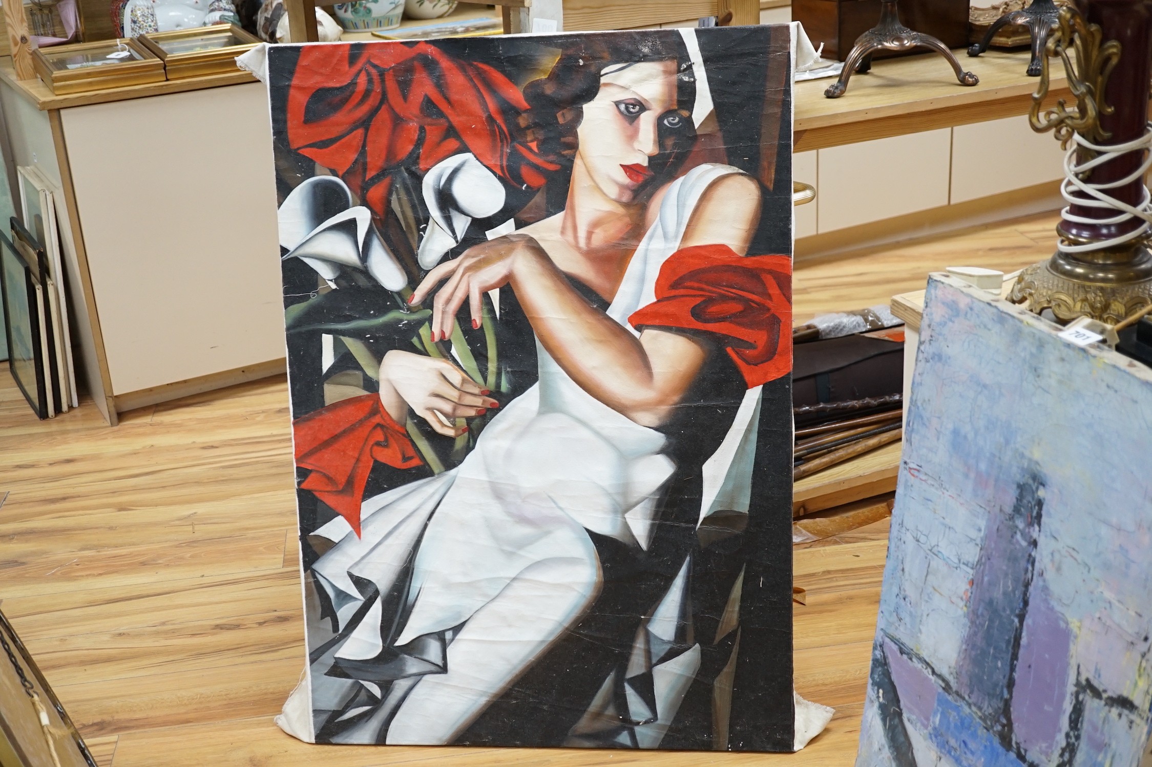After Tamara de Lempicka, oil on canvas, Woman holding lilies, 99 x 69cm, unframed